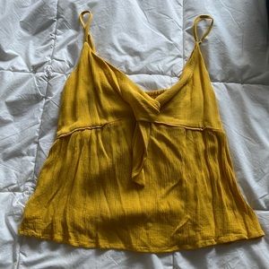 Yellow flowy tank top. Never worn